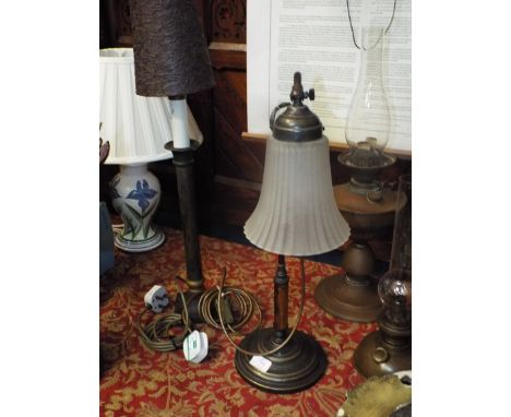 A Victorian brass rise and fall table lamp with frosted glass shade together with a column shaped table lamp