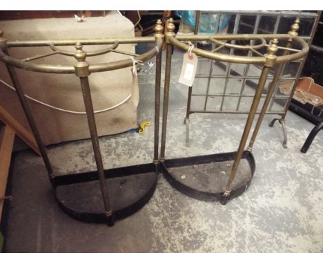 A pair of brass Victorian style demi lune umbrella/stick stands