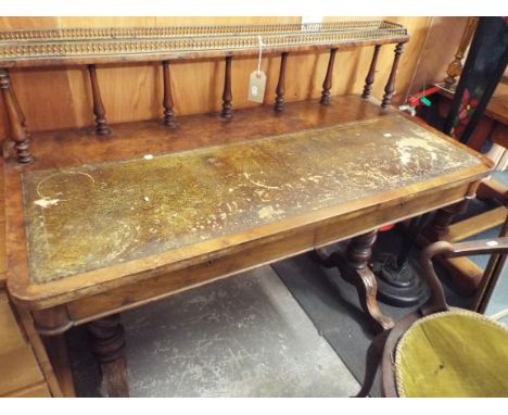 A 19thC burr walnut desk fitted with a brass galleried shelf raised on turned spindles above a tooled green leather insert an