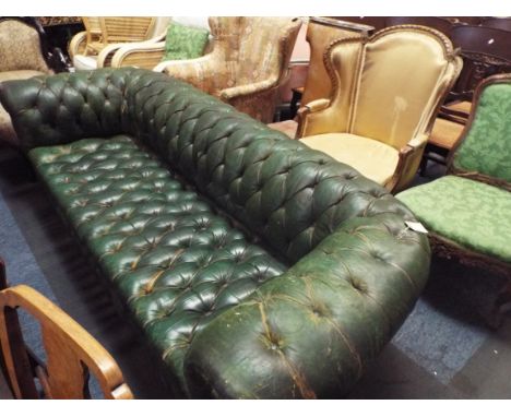 A green leather button back three seater Chesterfield sofa