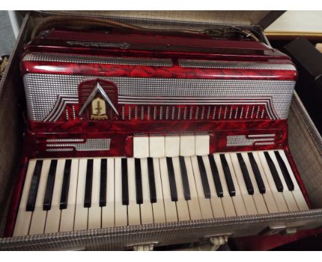 A mid-20thC Frontalini red marble effect accordion