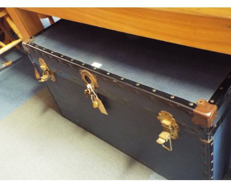 A blue metal bond steamer trunk