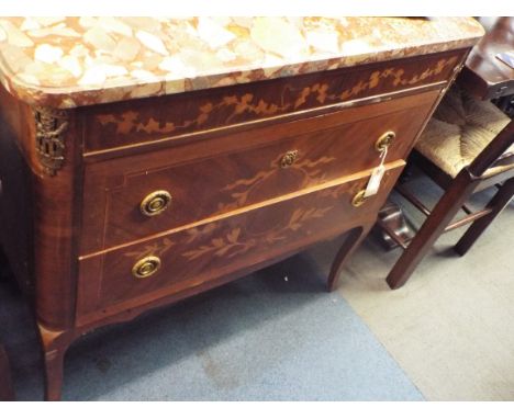 A 19thC French crossbanded walnut commode, the marble top above an ivy inlaid frieze with ormolu mounts over two long drawers
