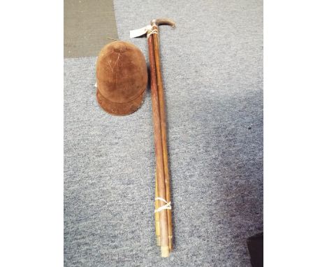 Three vintage walking canes with silver knop, horn and golf ball handles together with a child's New Triple Crown horse ridin
