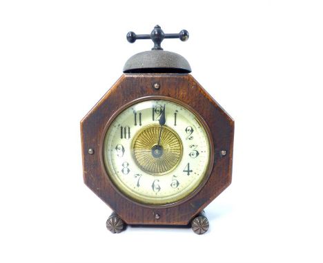 Stained oak alarm clock, of octagonal form, cream dial with radiating gilt centre, Roman numerals 17cm h.
