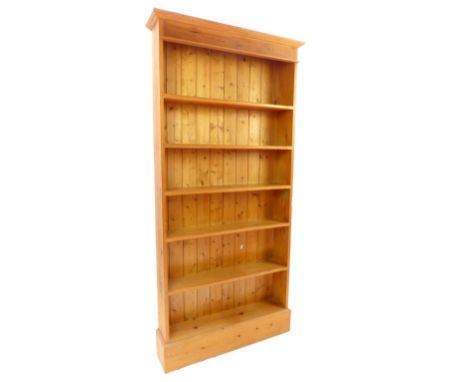 A 20th century pine six shelf pine open bookcase, raised on plinth base, 190 x 85cm