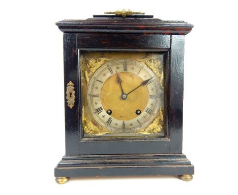 A George III ebonised and painted wood architectural striking mantle clock, with brass and silvered dial, the chapter ring wi