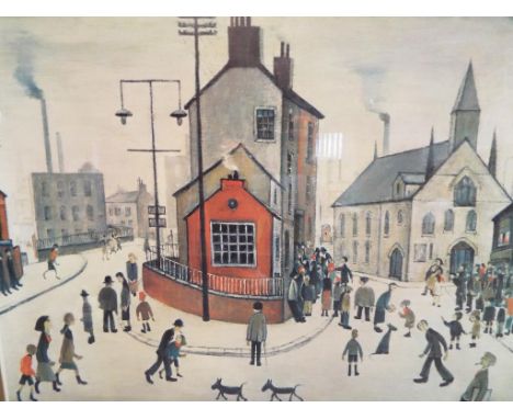 After L S Lowry - A print depicting a street in Clitheroe, mounted and framed under glass. Image size 53 cm x 66 cm.