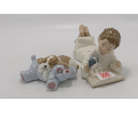 Nao figure of a boy reading: together with a dog sleeping on a toy (2) 