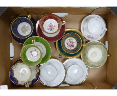 A collection of German floral and gild decorated small cups &amp; saucers: (9) 