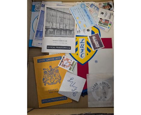 A selection of Leeds United football memorabilia, programmes, tickets, cards, badges and pendants
