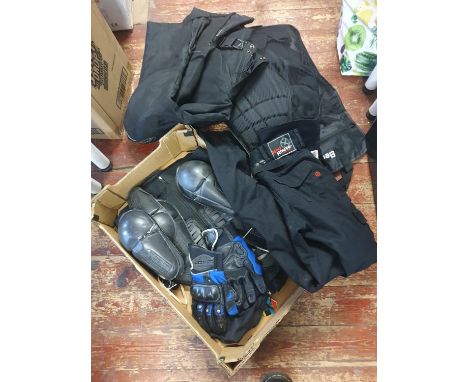 A job lot of assorted motorbike protective clothing including gloves etc