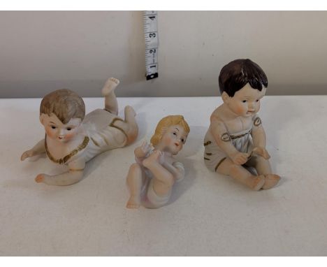 Three porcelain Piano babies, shipping unavailable