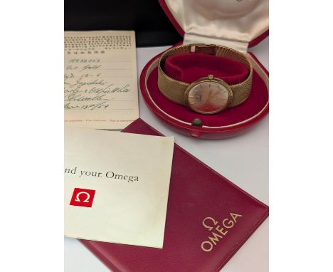 A vintage Omega watch with a 9ct gold body and 9ct gold strap (watch not running) total weight 54.24g