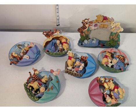 A selection of Disney Winnie the Pooh Bradford Exchange wall plaques with photo frame, shipping unavailable