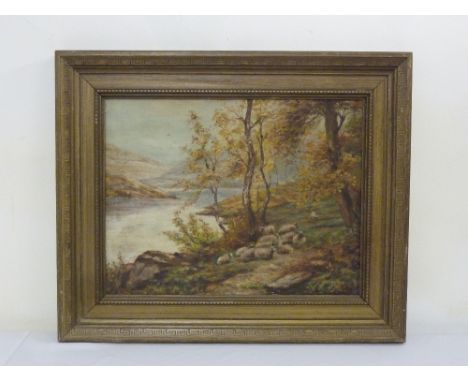A framed oil on panel of a river and mountain scene with sheep in the foreground, monogrammed K R bottom right, 33.5 x 44 cm