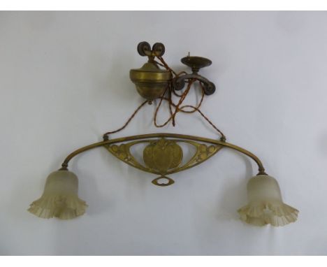 A Victorian brass two branch pendulum ceiling light with counter weight balance and glass shades