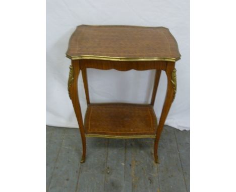 A rectangular two tier side table with inlaid satinwood and brass mounts