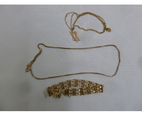 A quantity of  9ct gold jewellery to include a gate link bracelet, a chain with a Star of David pendant and a box link neckla