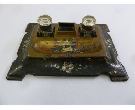A Victorian papier mache rectangular ink stand with two glass detachable ink wells on four bracket feet,  A/F
