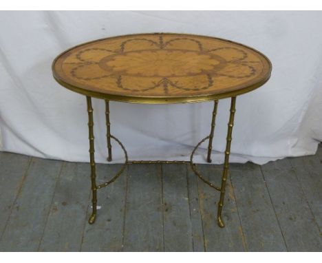 An oval Kingswood inlaid side table on simulated bamboo brass stand