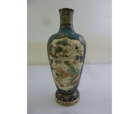 A Chinese style ceramic decorative lamp base decorated with flowers, leaves and trees