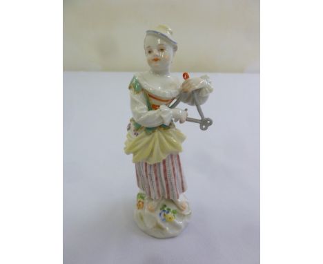 Meissen figurine of a lady playing a musical instrument on raised circular base, 13cm (h)