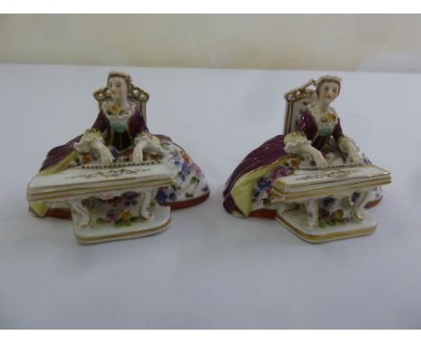 A pair of Vienna porcelain figurines of ladies playing a harpsichord, marks to the base, 6cm (h)