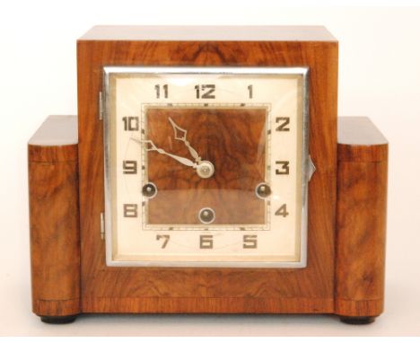  An Art Deco walnut eight day strike mantle clock with Arabic numerals to a square dial, height 22cm. 