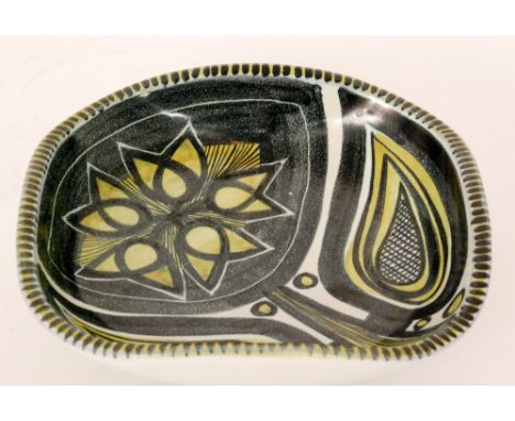  A post war Danish studio pottery bowl of rounded square form decorated with a hand painted stylised flower in black and yell