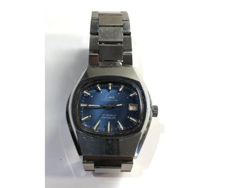 Vintage limit international gents wristwatch winds and ticks but no warranty given 