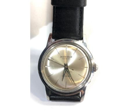 Vintage Leuba louis Geneve gents wristwatch watchwill wind and tick but no warranty is given 