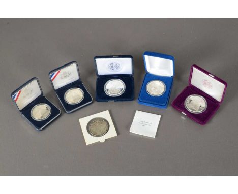 A collection of six United States silver coins and medallions, including a 2014 1 Ounce Silver $1, a 1996 1 Ounce Silver Doll