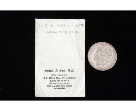 An 1878 United States Carson City Mint silver Morgan Dollar, scarcer date coin in good condition with pleasing detail
