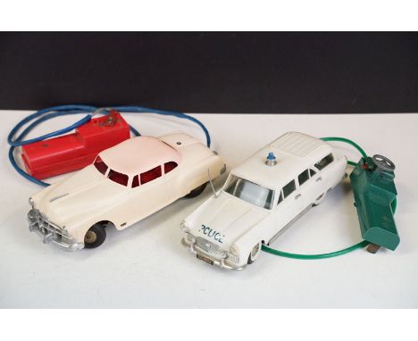 Two Marx Toys remote controlled model cars to include battery operated remote control M1 Police Car and electric car in cream