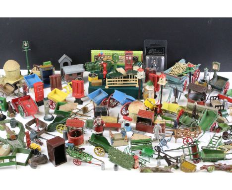 Large quantity of mainly Britains and some Dinky accessories to include horse carts, push carts, milk churns, fences, rollers