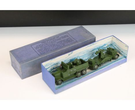 Boxed Dinky 161 Mobile Anti-Aircraft Unit diecast model in military green, complete with figure driver and inner display box,
