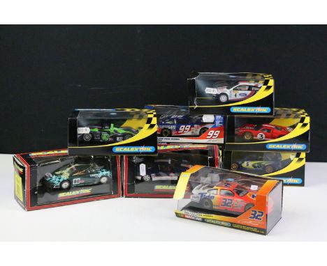 Nine boxed / cased Scalextric slot cars to include C2371 #99 Ford Taurus, C2341 Subaru Impreza WRC Works 2001 No. 5, C2342 Fo