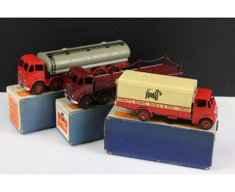 Three boxed Dinky diecast models to include 505 Foden Flat Truck with chains in maroon and maroon hubs, 504 Foden 14-Ton Tank