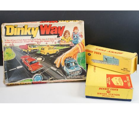 Four boxed Dinky items to include printed card roadway and road signs, missing instructions and 4 x diecast models, 502 Plast