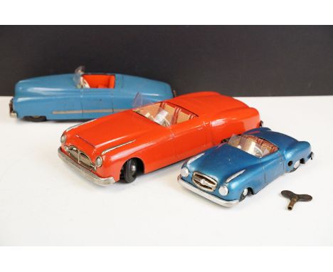 Three JNF West German US Zone clockwork wind up tin plate models to include JNF Favorit in blue with red interior, white stee