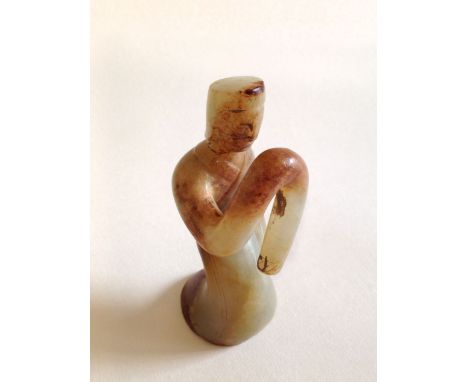 Intricately carved in white Jade showing a detailed face. 10cm H