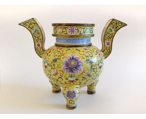 A stunning example of a painted enamel censer/vase. A beautiful piece supported on 3 legs. Brightly enamelled in yellow with 