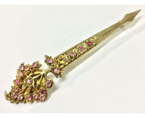 Indian gilt white metal brooch with inlaid pink stones - form of an arrow