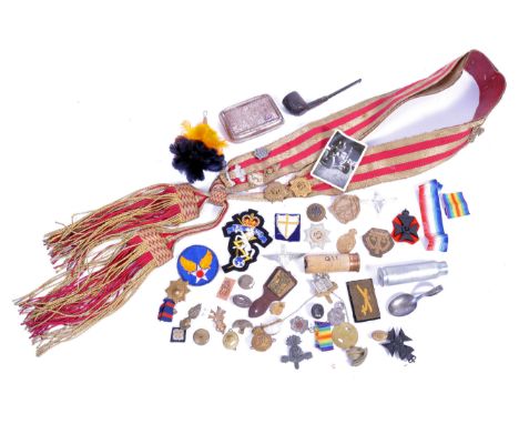 A collection of assorted militaria - WWI and WWII Second World War related military items, to include; a uniform sash, variou