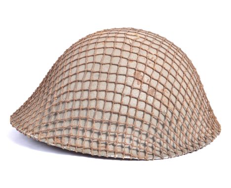 An original WWII Second World War c1944 D-Day British Army ' Turtle ' steel combat helmet. Nice example, complete with inner 