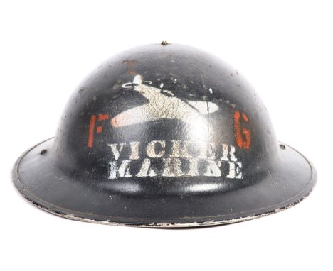 An incredibly rare original WWII Second World War steel Brodie helmet from the Vicker's Engine factory. The helmet featuring 