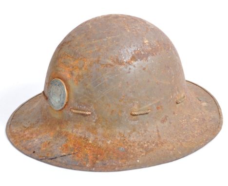 A rare WWII Second World War related ' London Transport ' ARP Zuckerman steel helmet. The helmet of usual form, complete with
