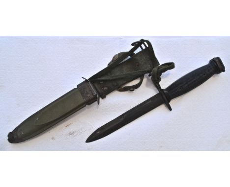 A 20th Century conflicts US United States Forces M7 bayonet having a black chequered grips, pomeel release clips, straight qu