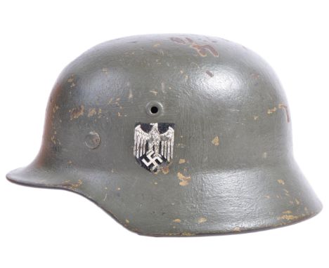 A rare original WWII Second World War Third Reich Nazi German Army M35 steel infantry helmet. Single decal variation, the rim